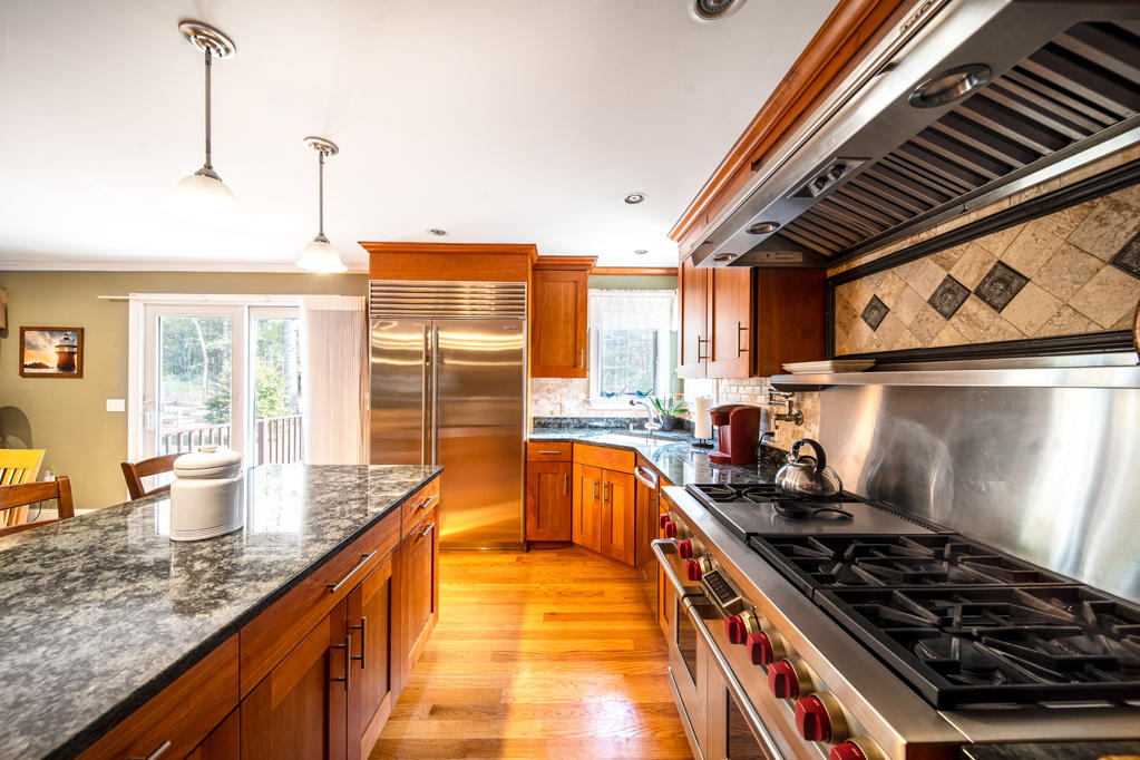 527 County Road Pocasset, MA 02559 - Photo 3 of 25 a kitchen with stainless steel appliances granite countertop a stove and a sink