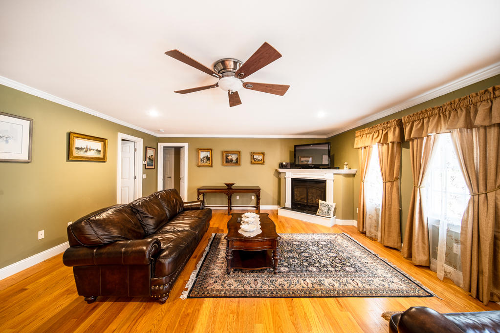 527 County Road Pocasset, MA 02559 - Photo 5 of 25 a living room with furniture fireplace and flat screen tv