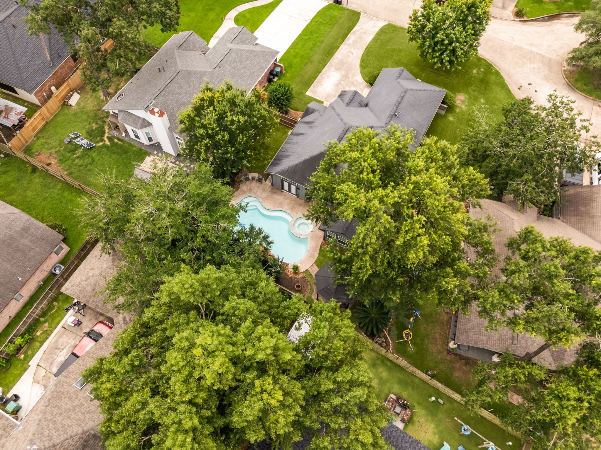 1915 Mercoal Drive Spring, TX 77386 - Photo 45 of 50 Elevated view highlighting the home’s position on the lot and surrounding landscape.