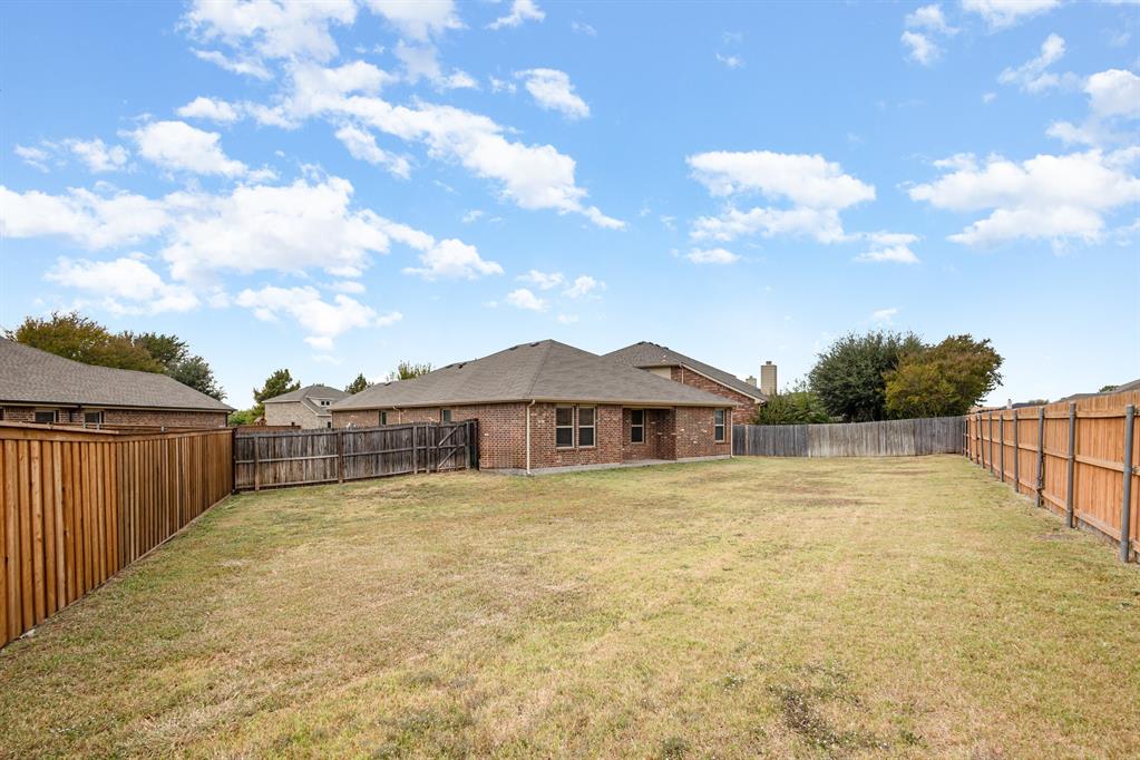 1025 Bend Court Forney, TX 75126 - Photo 11 of 12 a view of a house with a yard