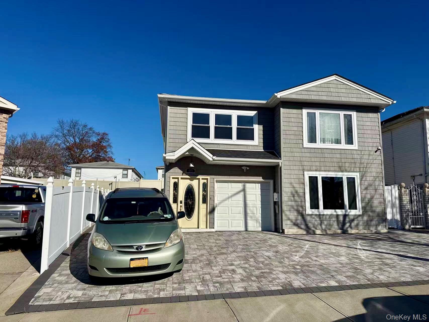 a front view of a house with parking space