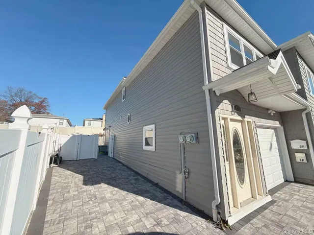 a view of a house with backyard and deck