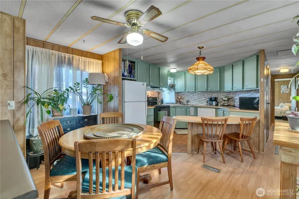 a view of a dining room with furniture and wooden floor