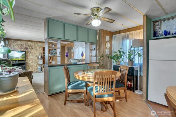 a dining room with furniture and window
