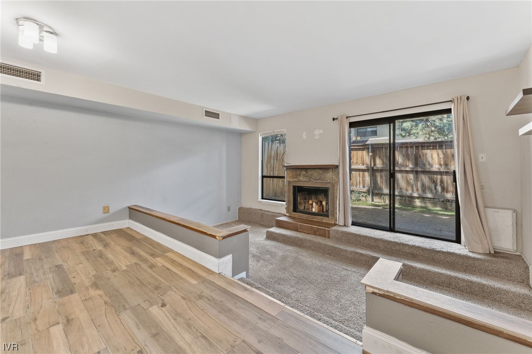 4185 Baker Lane, Unit 4185 Reno, NV 89509 - Photo 11 of 30 a living room with furniture and a fireplace