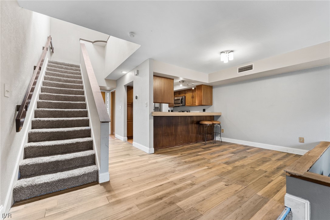 4185 Baker Lane, Unit 4185 Reno, NV 89509 - Photo 15 of 30 a view of kitchen with wooden floor and electronic appliances