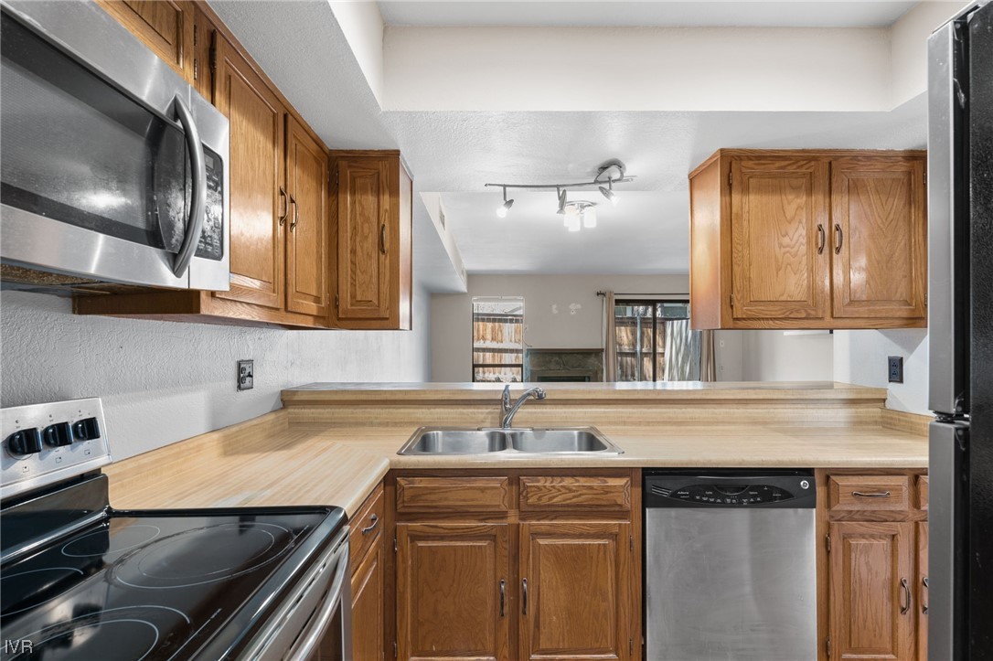 4185 Baker Lane, Unit 4185 Reno, NV 89509 - Photo 3 of 30 a kitchen with a sink and cabinets