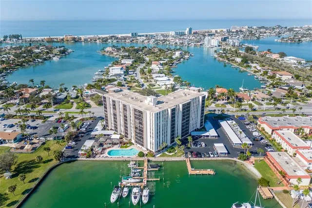 a view of a chairs and table in patio with a lake view