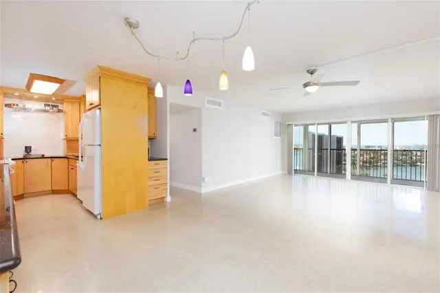 a view of empty room with floor to ceiling window
