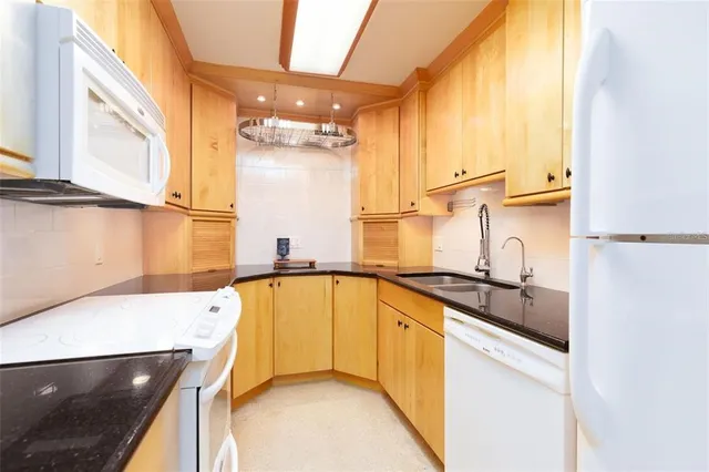a kitchen with stainless steel appliances a sink and a stove