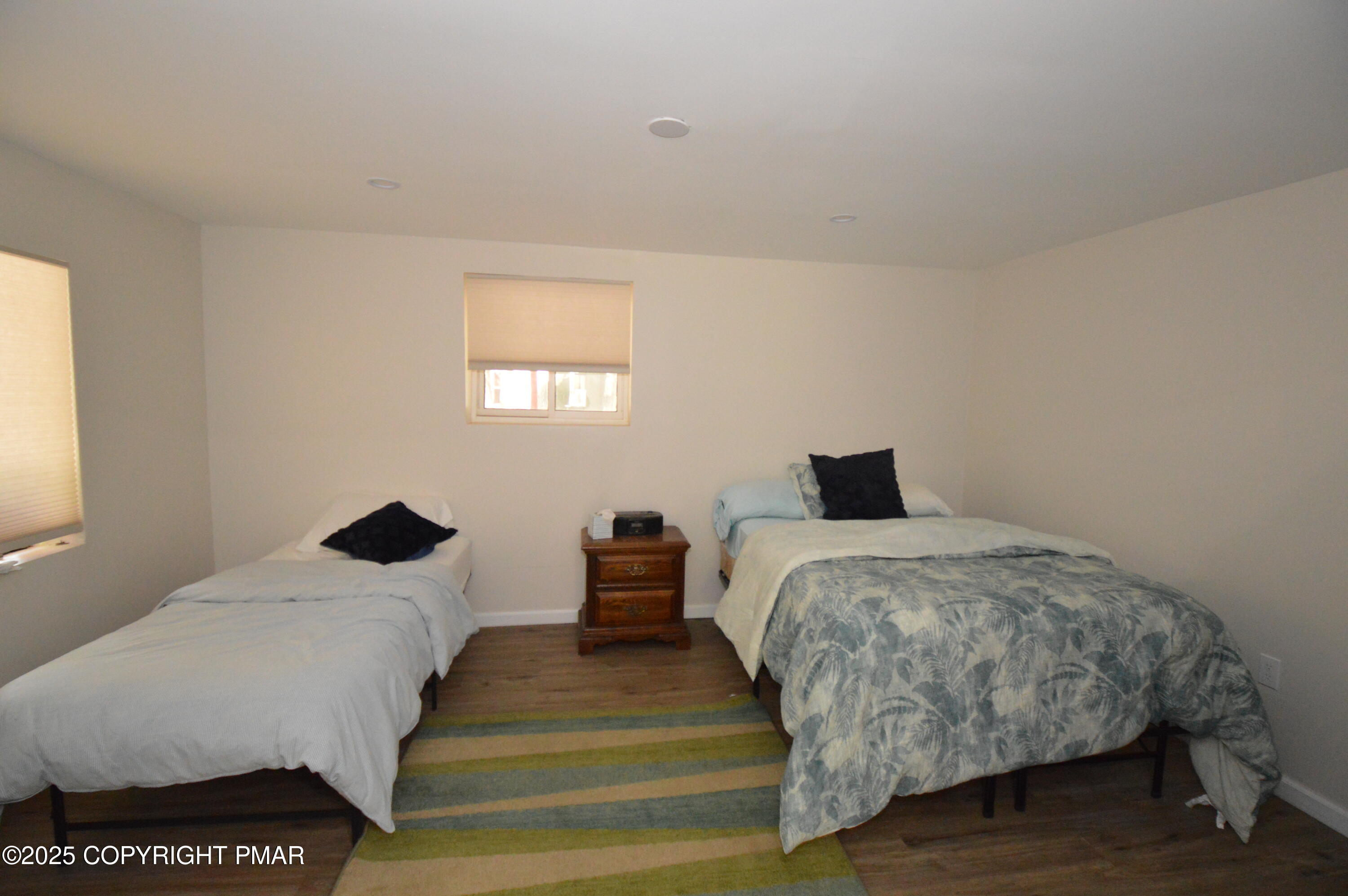128 Ashley Court Bushkill, PA 18324 - Photo 18 of 43 a bedroom with double bed and a window