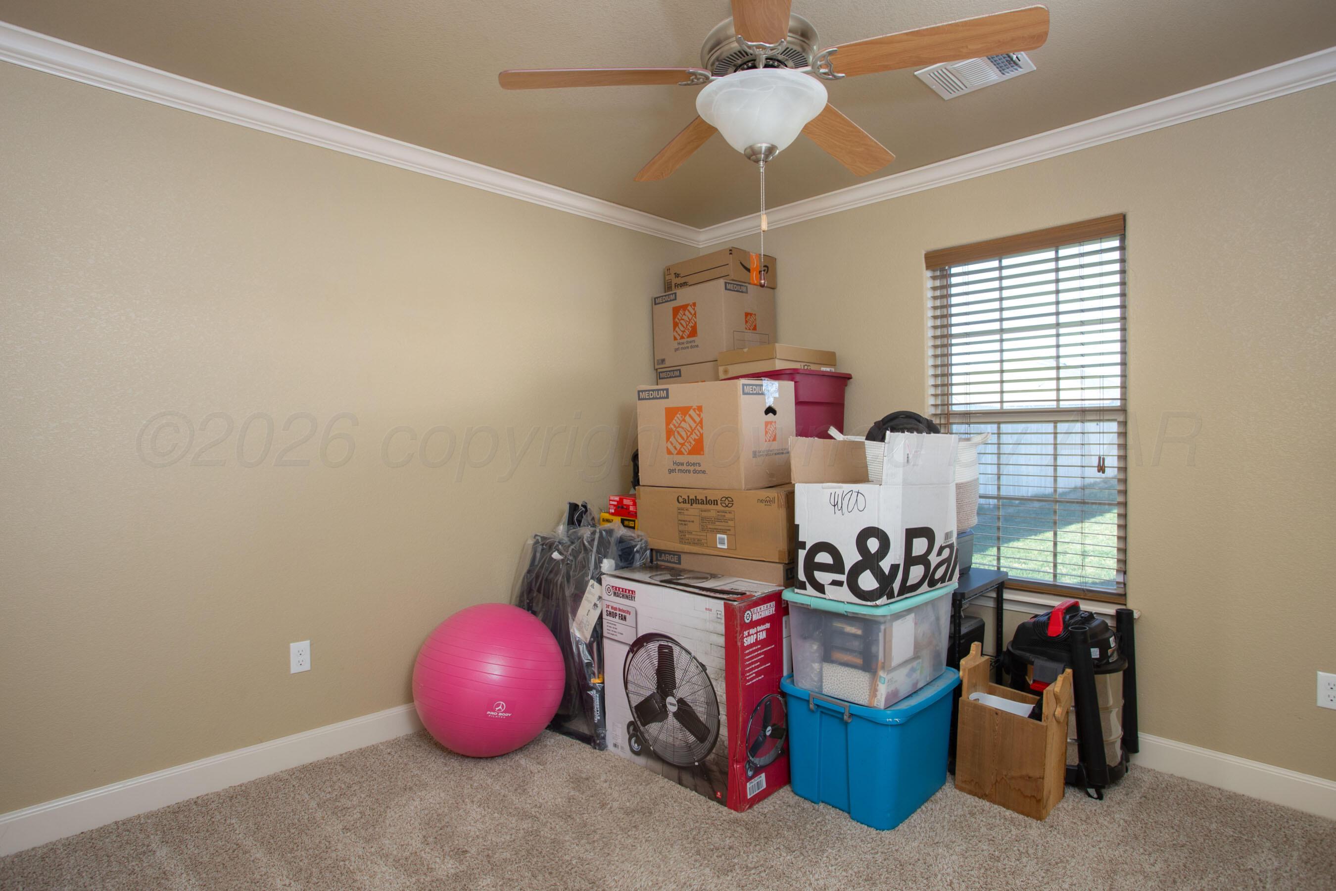 4812 Gloster Street Amarillo, TX 79118 - Photo 12 of 16 a room with storage and utility