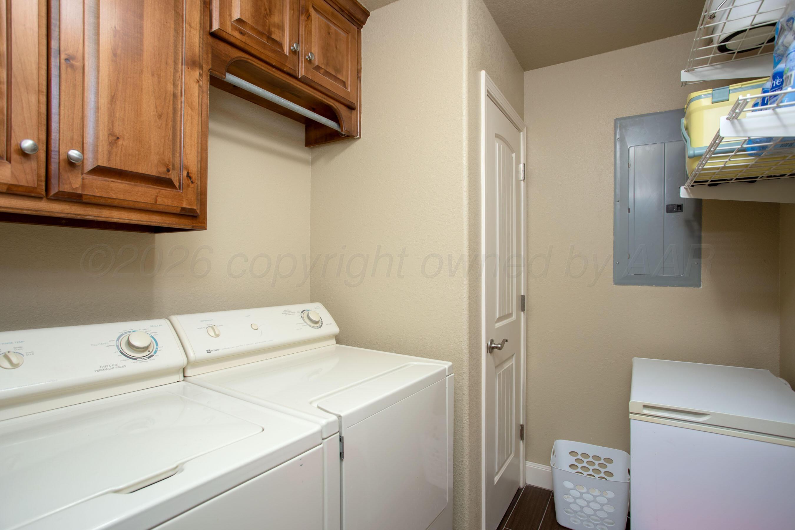 4812 Gloster Street Amarillo, TX 79118 - Photo 13 of 16 a utility room with dryer and washer