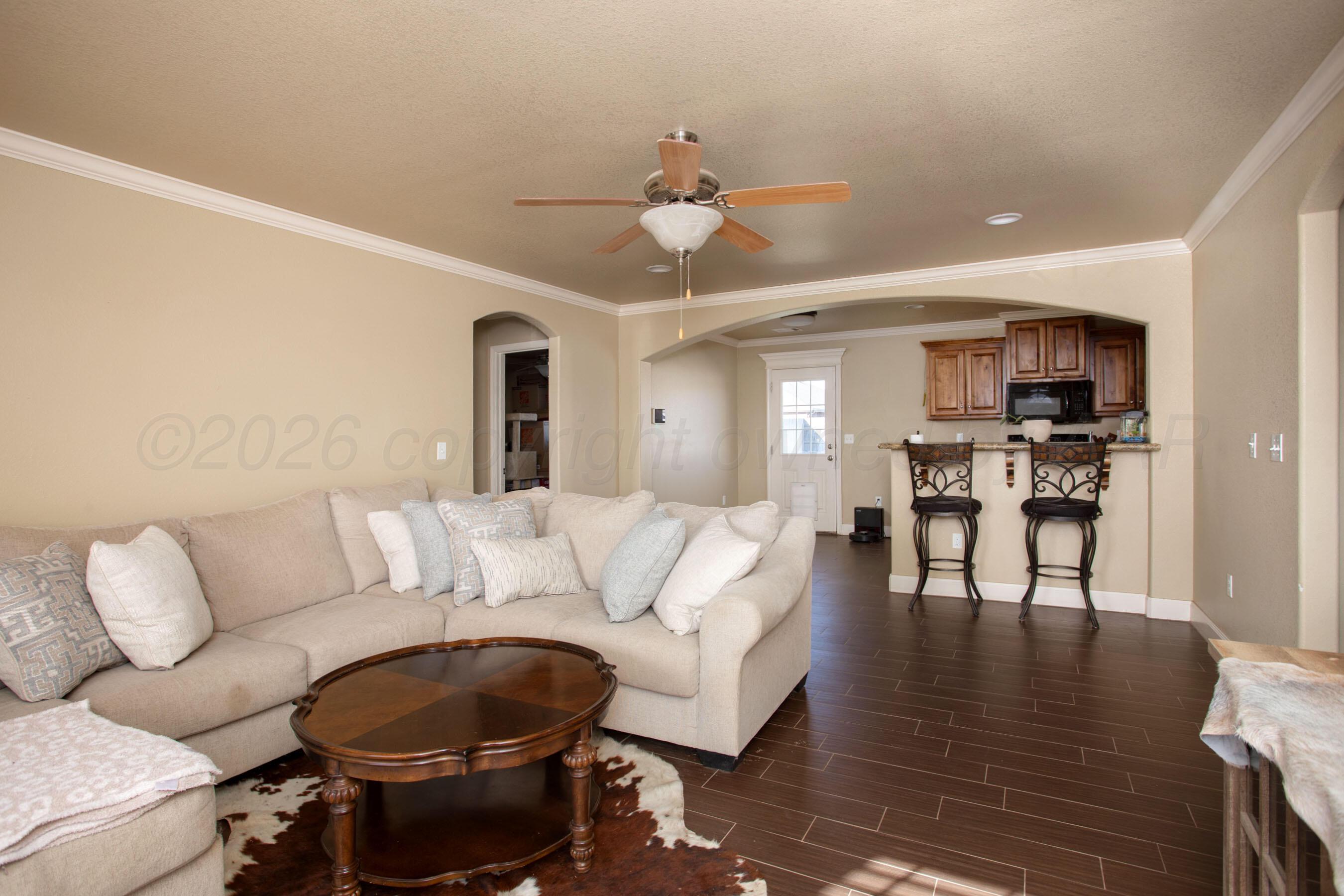 4812 Gloster Street Amarillo, TX 79118 - Photo 2 of 16 a living room with furniture and a wooden floor