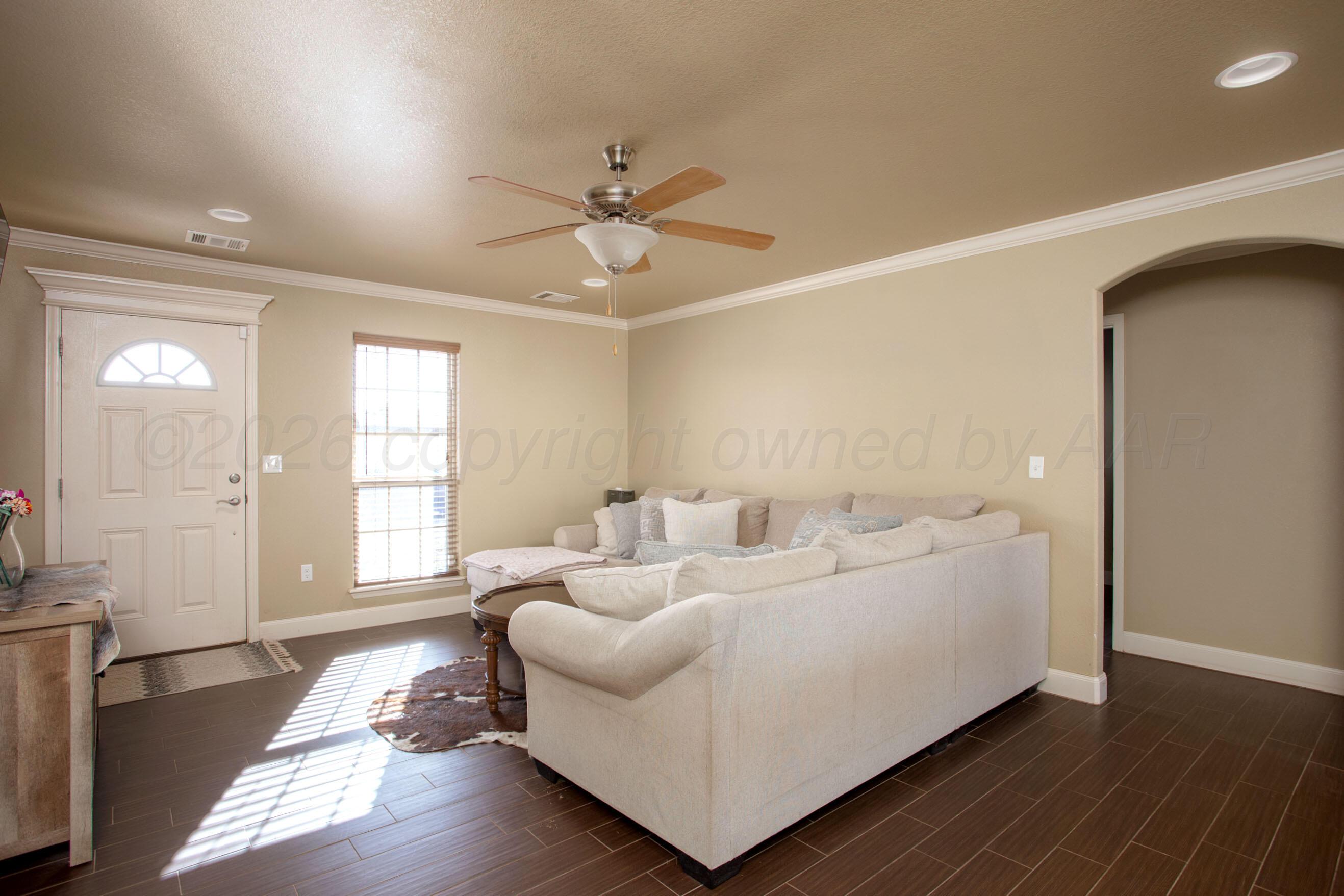 4812 Gloster Street Amarillo, TX 79118 - Photo 3 of 16 a living room with furniture and wooden floor