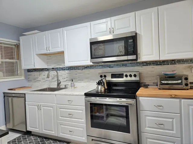 a room with furniture and a lamp