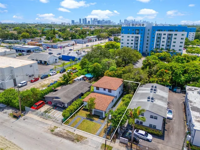 an aerial view of residential houses with outdoor space