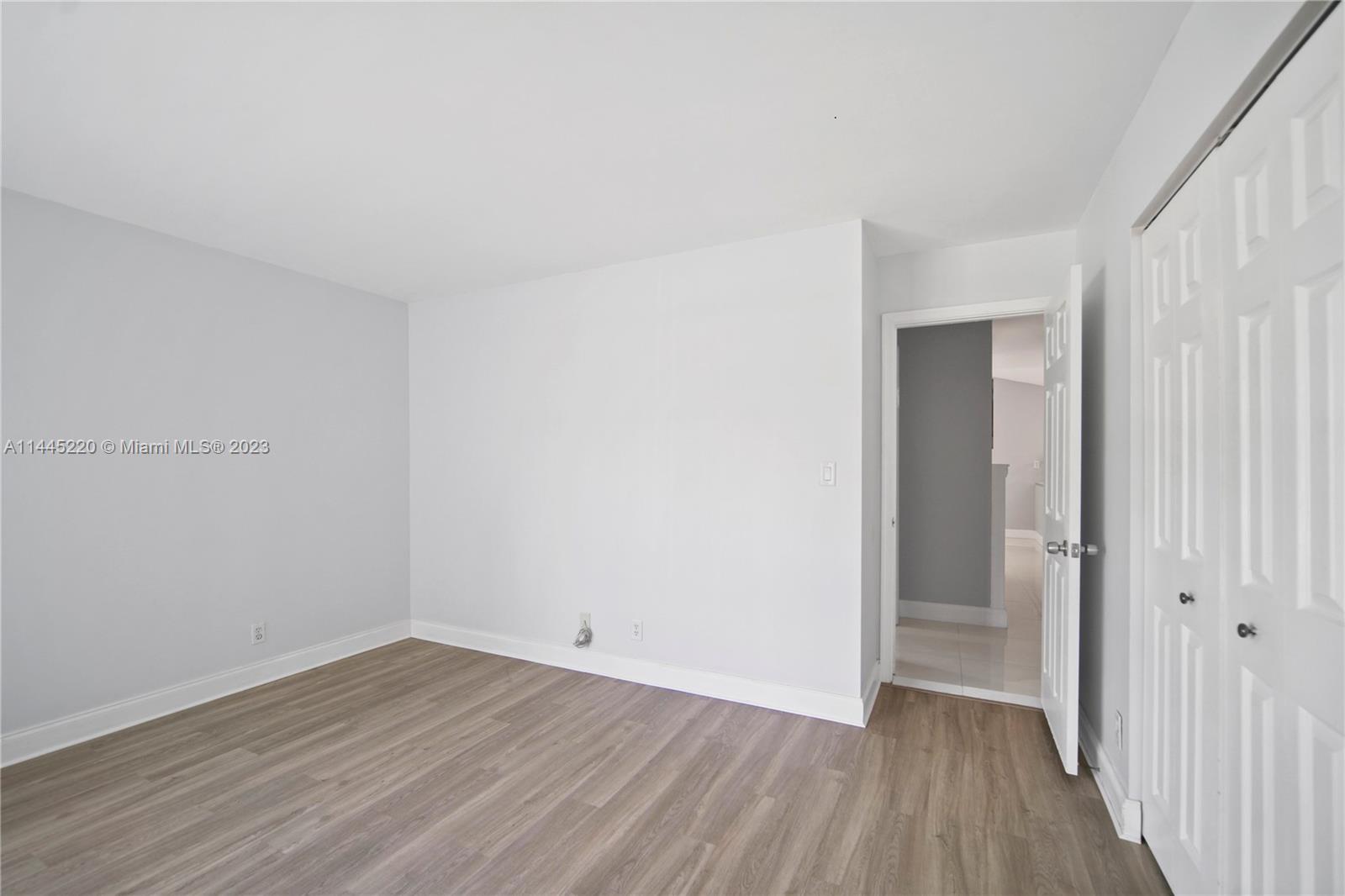 10161 Camelback Lane Boca Raton, FL 33498 - Photo 14 of 24 a view of a room with wooden floor