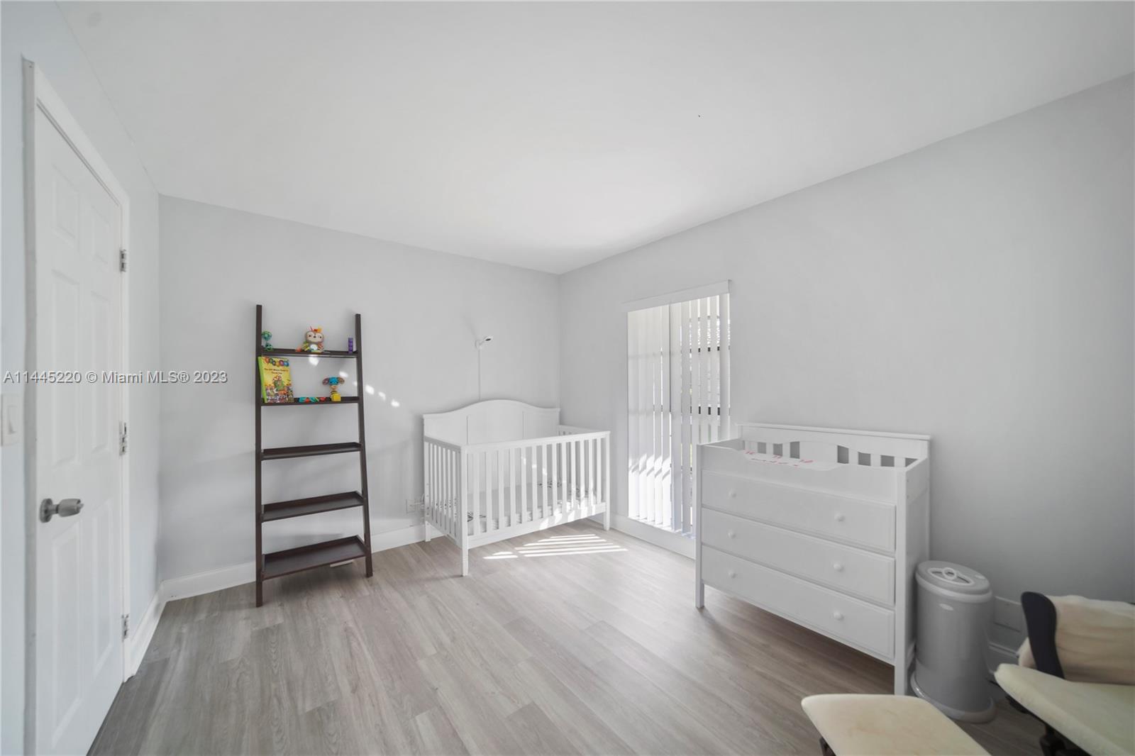10161 Camelback Lane Boca Raton, FL 33498 - Photo 15 of 24 a bedroom with a bed and a couch