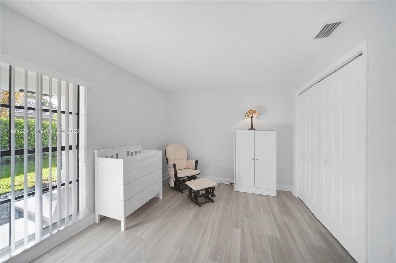 10161 Camelback Lane Boca Raton, FL 33498 - Photo 16 of 24 a room that has a bed and a chair in it