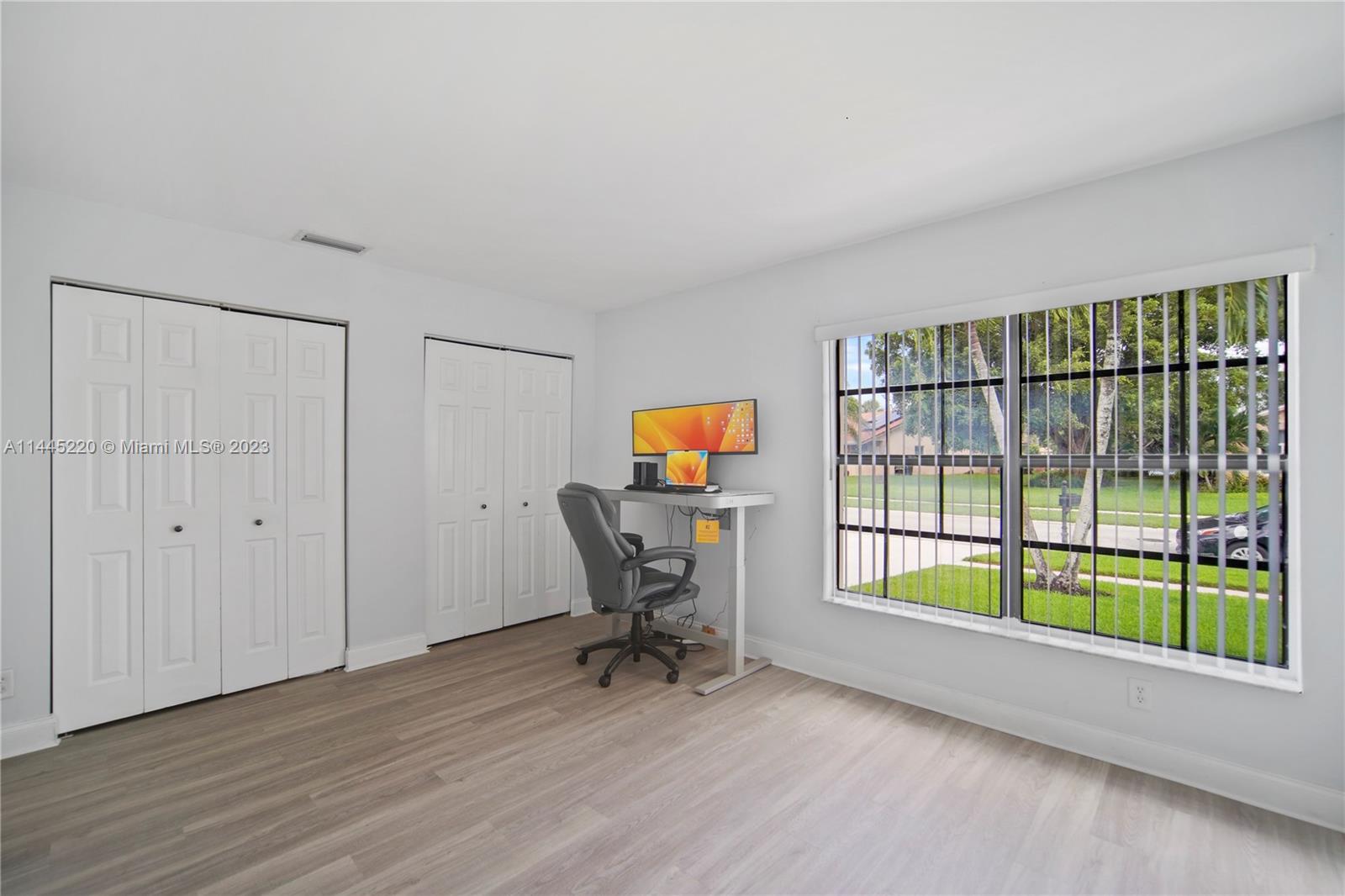 10161 Camelback Lane Boca Raton, FL 33498 - Photo 3 of 24 a view of a workspace with furniture and a window