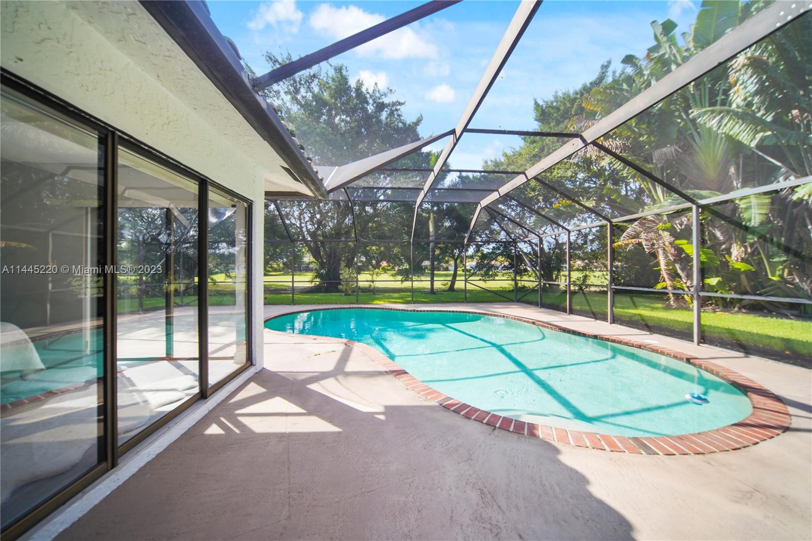 10161 Camelback Lane Boca Raton, FL 33498 - Photo 4 of 24 a view of a swimming pool with a backyard