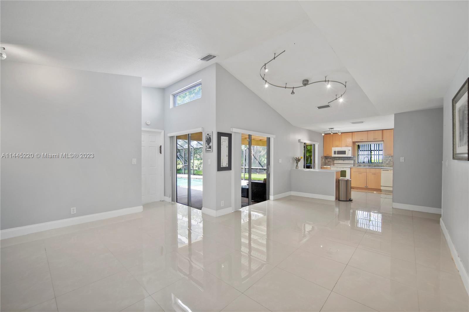 10161 Camelback Lane Boca Raton, FL 33498 - Photo 9 of 24 a view of empty room with wooden floor