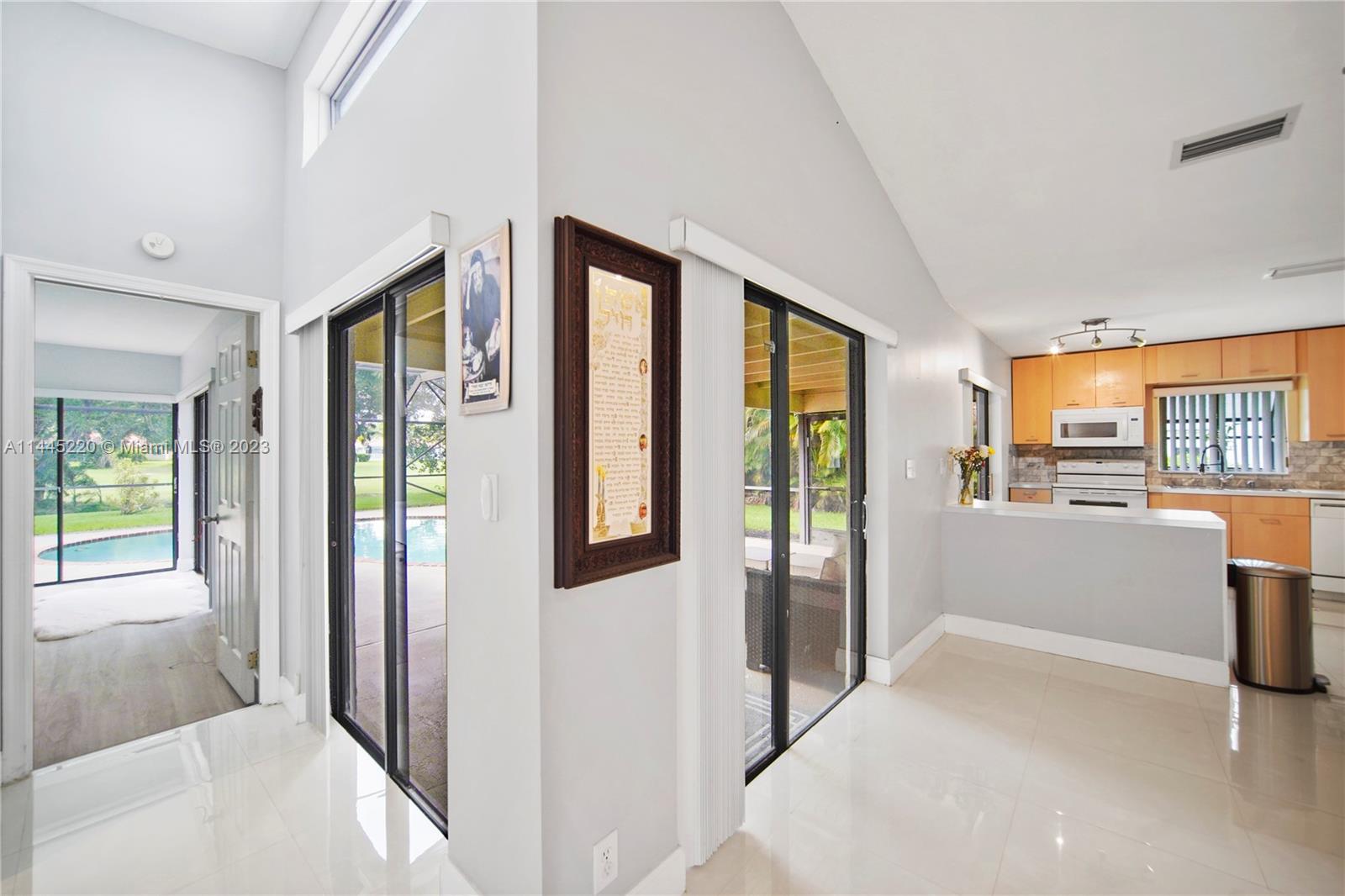 10161 Camelback Lane Boca Raton, FL 33498 - Photo 10 of 24 a view of hallway with furniture and a window