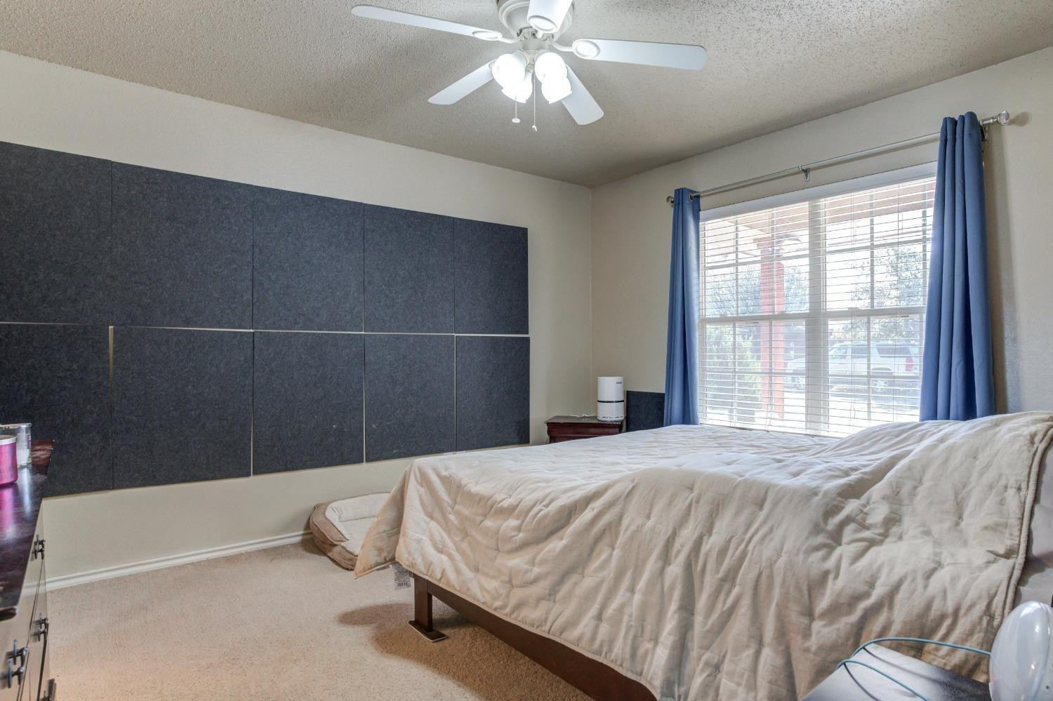 3114 109th Street Lubbock, TX 79423 - Photo 16 of 43 a bedroom with a bed and a window