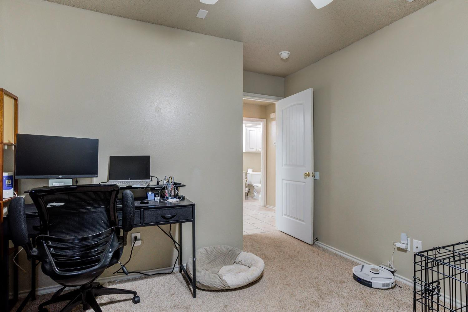 3114 109th Street Lubbock, TX 79423 - Photo 22 of 43 a view of a workspace with furniture and a window