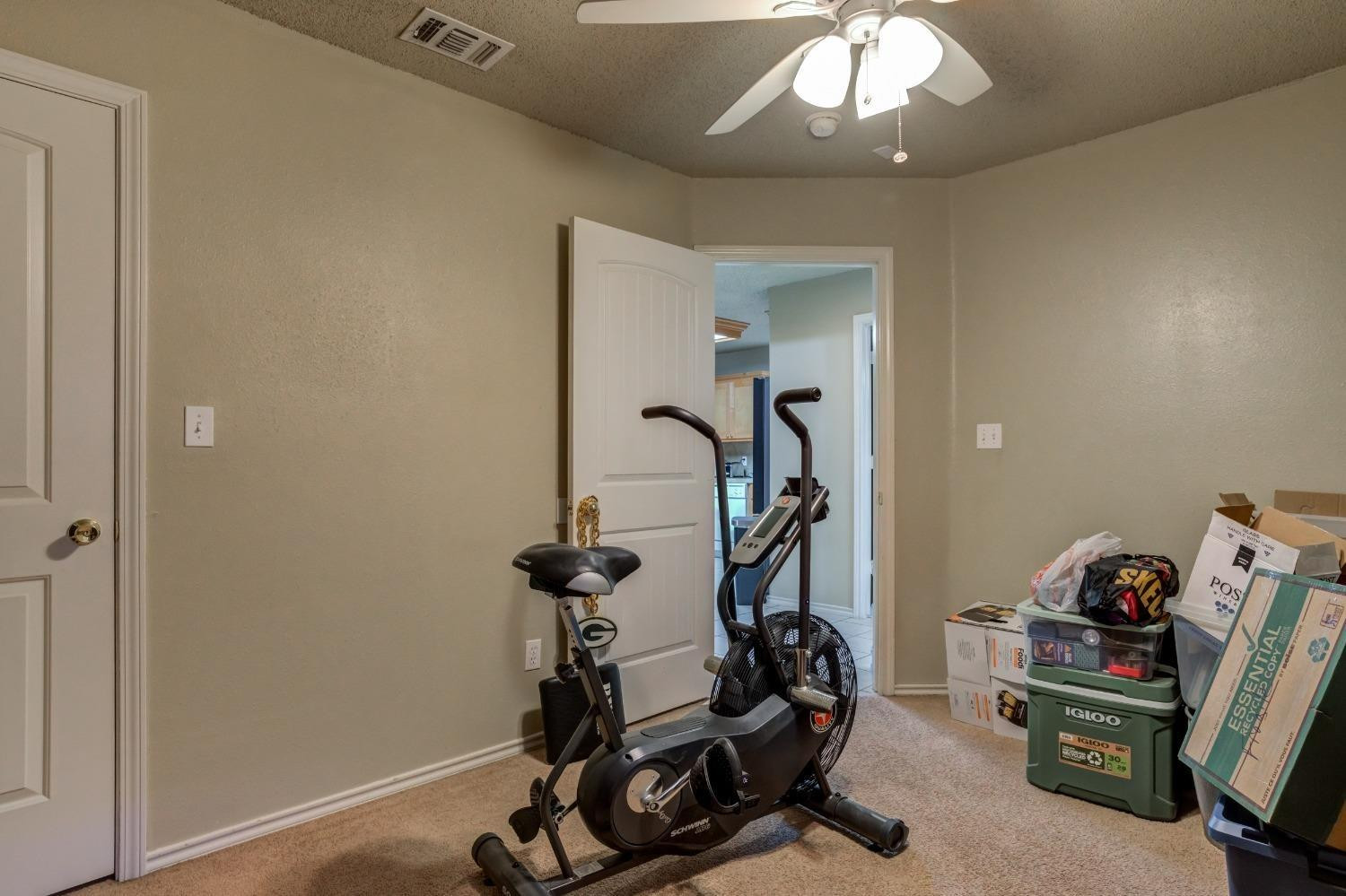 3114 109th Street Lubbock, TX 79423 - Photo 25 of 43 a view of a room with gym equipment