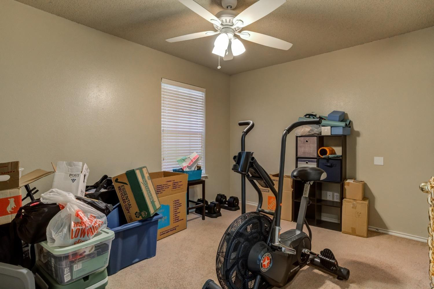 3114 109th Street Lubbock, TX 79423 - Photo 26 of 43 a view of a room with gym equipment