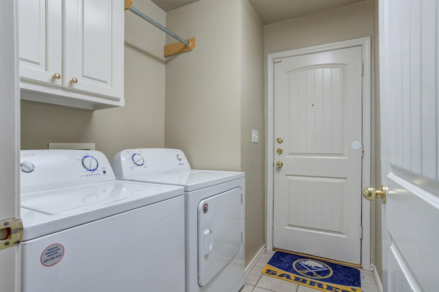 3114 109th Street Lubbock, TX 79423 - Photo 27 of 43 a view of storage and utility room with washer and dryer