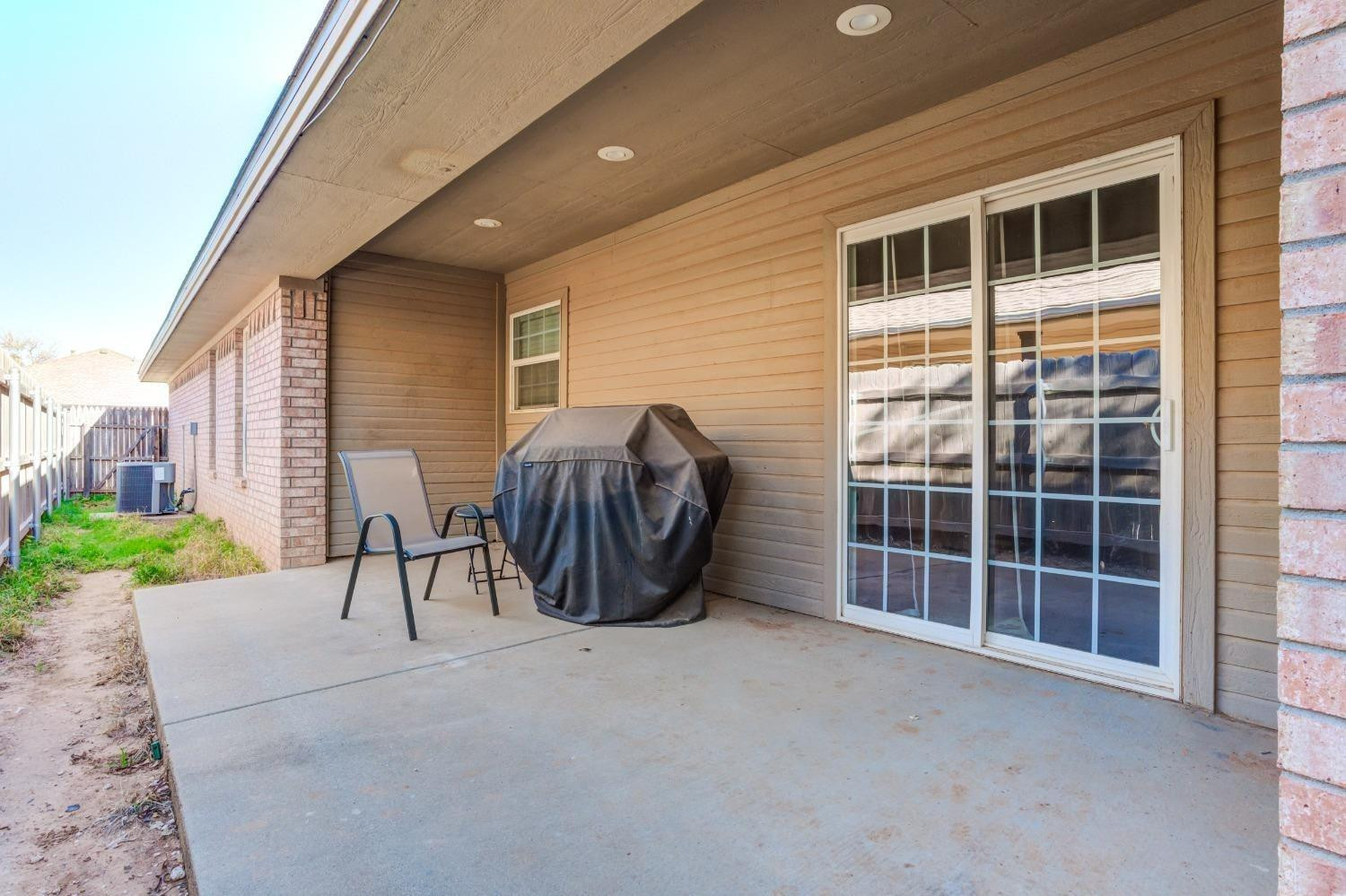3114 109th Street Lubbock, TX 79423 - Photo 28 of 43 a view of a patio with table and chairs and potted plants
