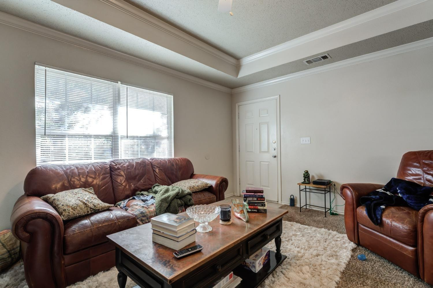 3114 109th Street Lubbock, TX 79423 - Photo 34 of 43 a living room with furniture and a window