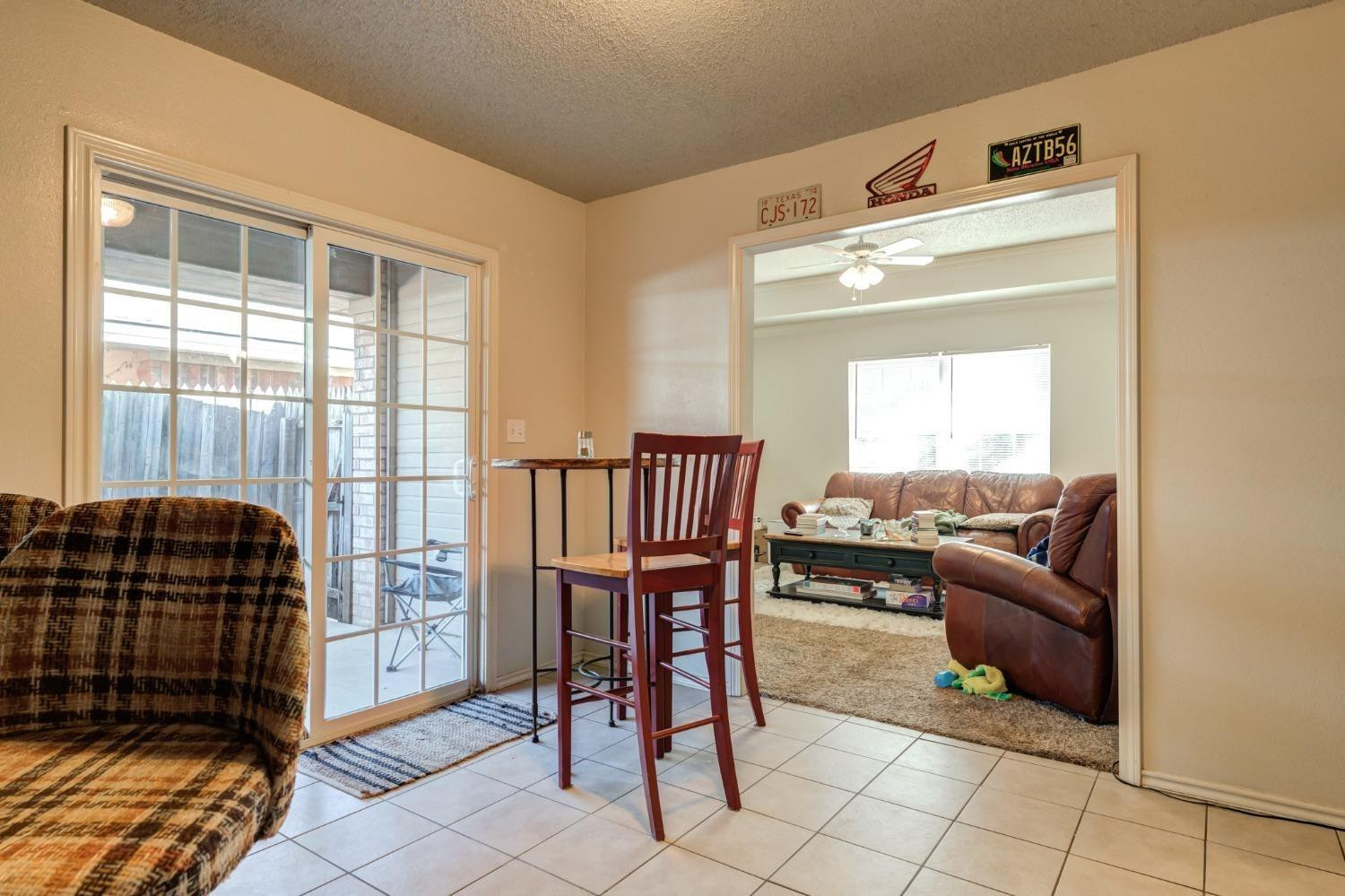 3114 109th Street Lubbock, TX 79423 - Photo 39 of 43 a living room with furniture and a window