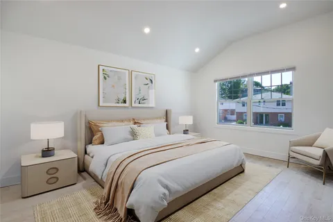 a bedroom with a large bed and a couch