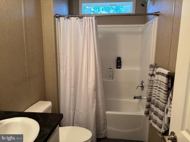 31706 Janice Road Lewes, DE 19958 - Photo 13 of 20 a bathroom with a toilet a sink and bathtub