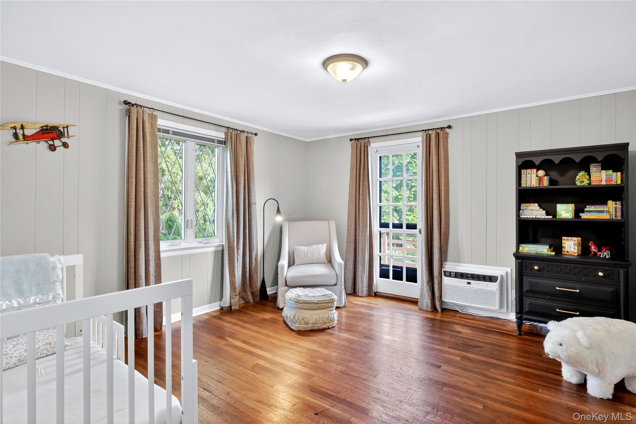 142 Mill Spring Road Manhasset, NY 11030 - Photo 14 of 23 a living room with furniture and wooden floor