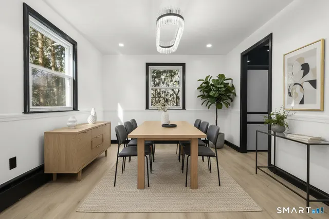 a dining room with furniture and window