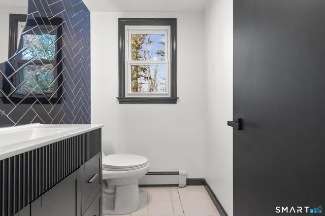 a bathroom with a toilet and a sink