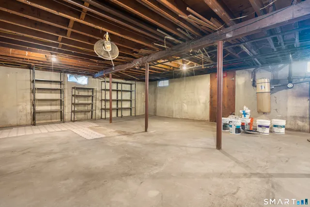 a lobby with furniture and a flat screen tv