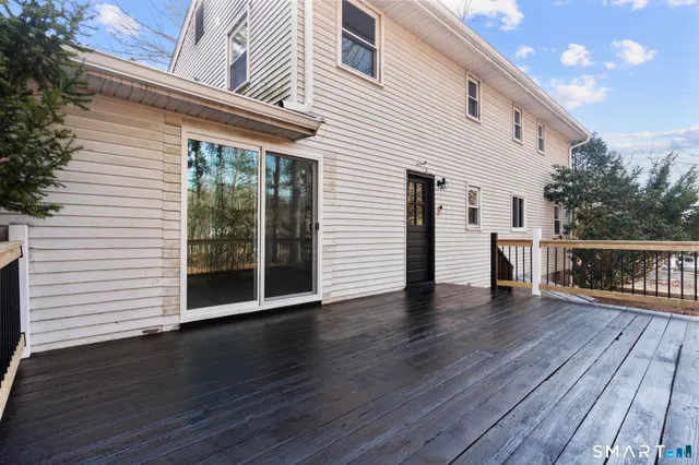 a view of deck with wooden floor and fence