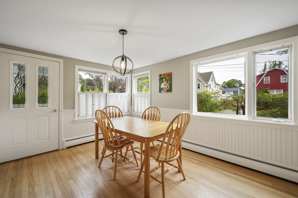 6 Treat Road Marblehead, MA 01945 - Photo 11 of 22 a dining room with furniture a chandelier and wooden floor