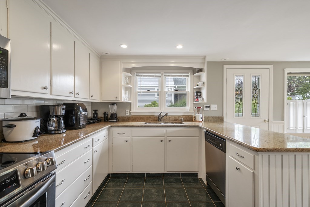 6 Treat Road Marblehead, MA 01945 - Photo 13 of 22 a kitchen with a sink stove and cabinets