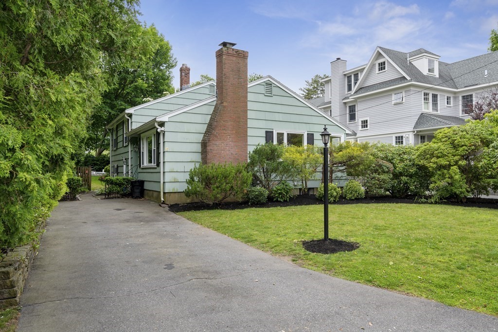 6 Treat Road Marblehead, MA 01945 - Photo 2 of 22 a view of a house with a yard and plants