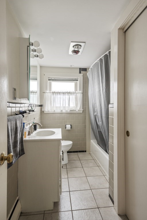 6 Treat Road Marblehead, MA 01945 - Photo 6 of 22 a view of a bathroom with a sink and mirror