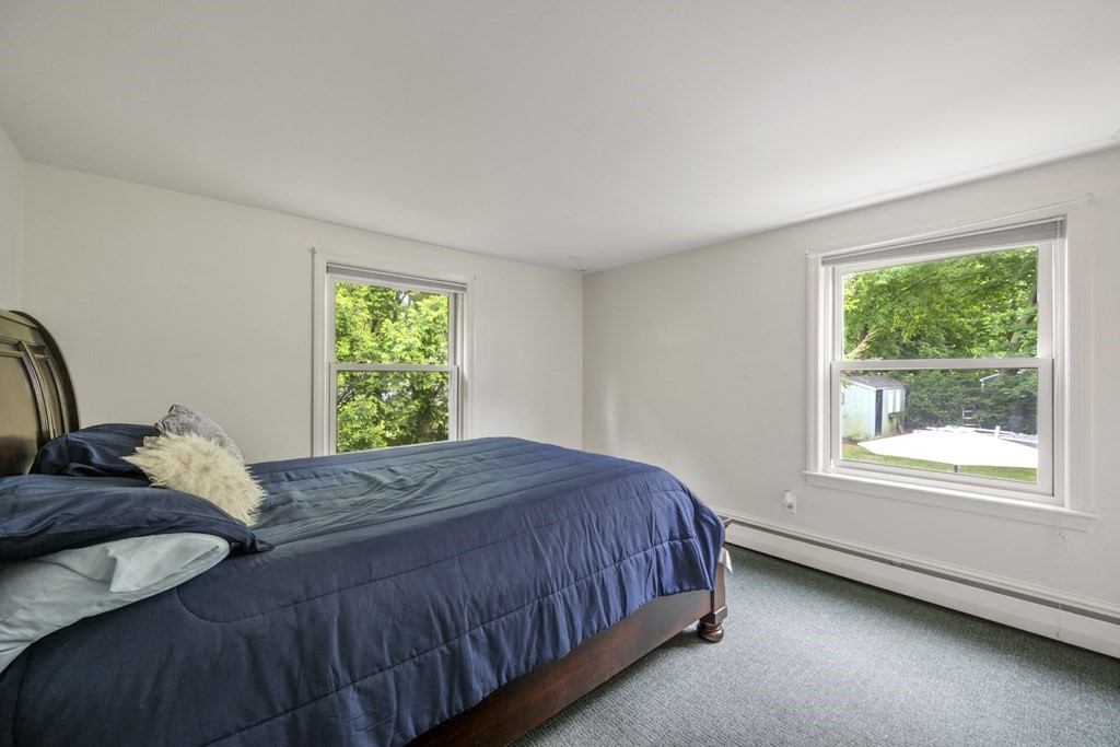 6 Treat Road Marblehead, MA 01945 - Photo 7 of 22 a bedroom with a bed and window