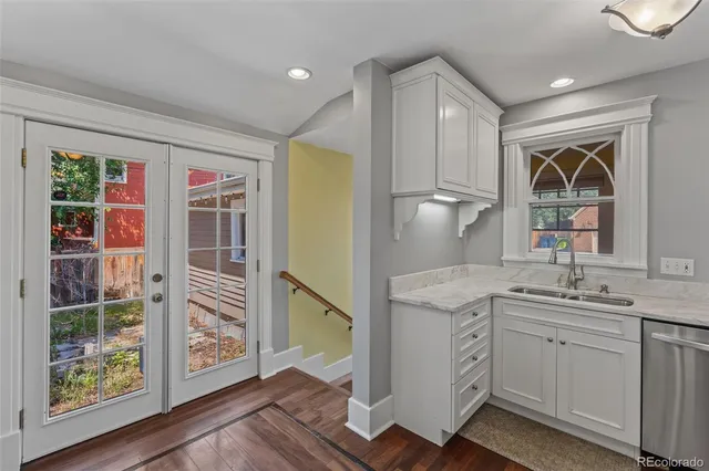 a kitchen with a sink and a refrigerator