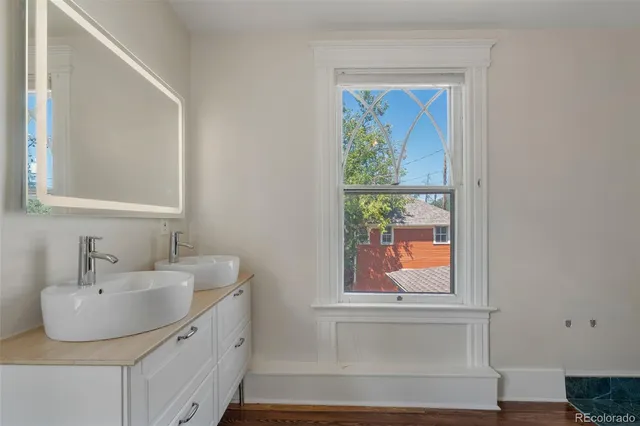 a bathroom with a sink and a window